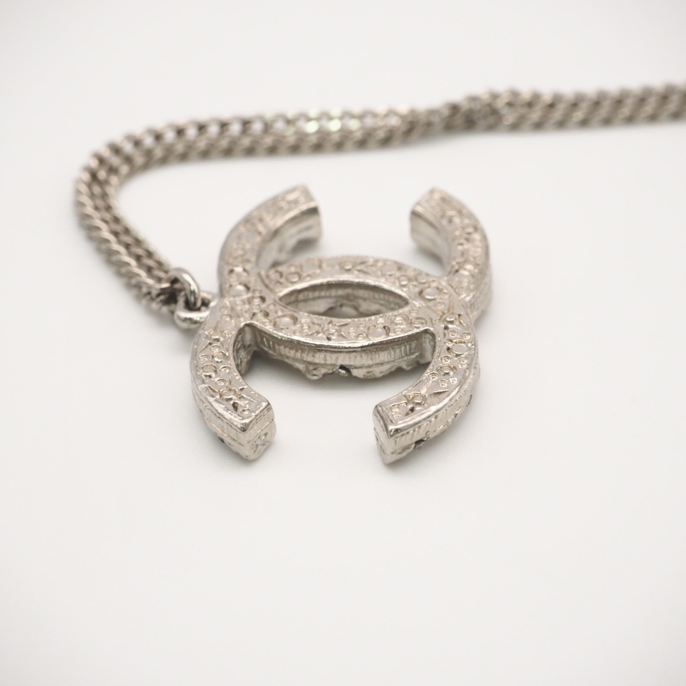 CHANEL Authentic Silver Logo Necklace - Picture 9 of 13
